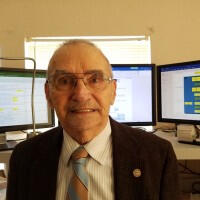 Dale Wilkins with 3 monitors
